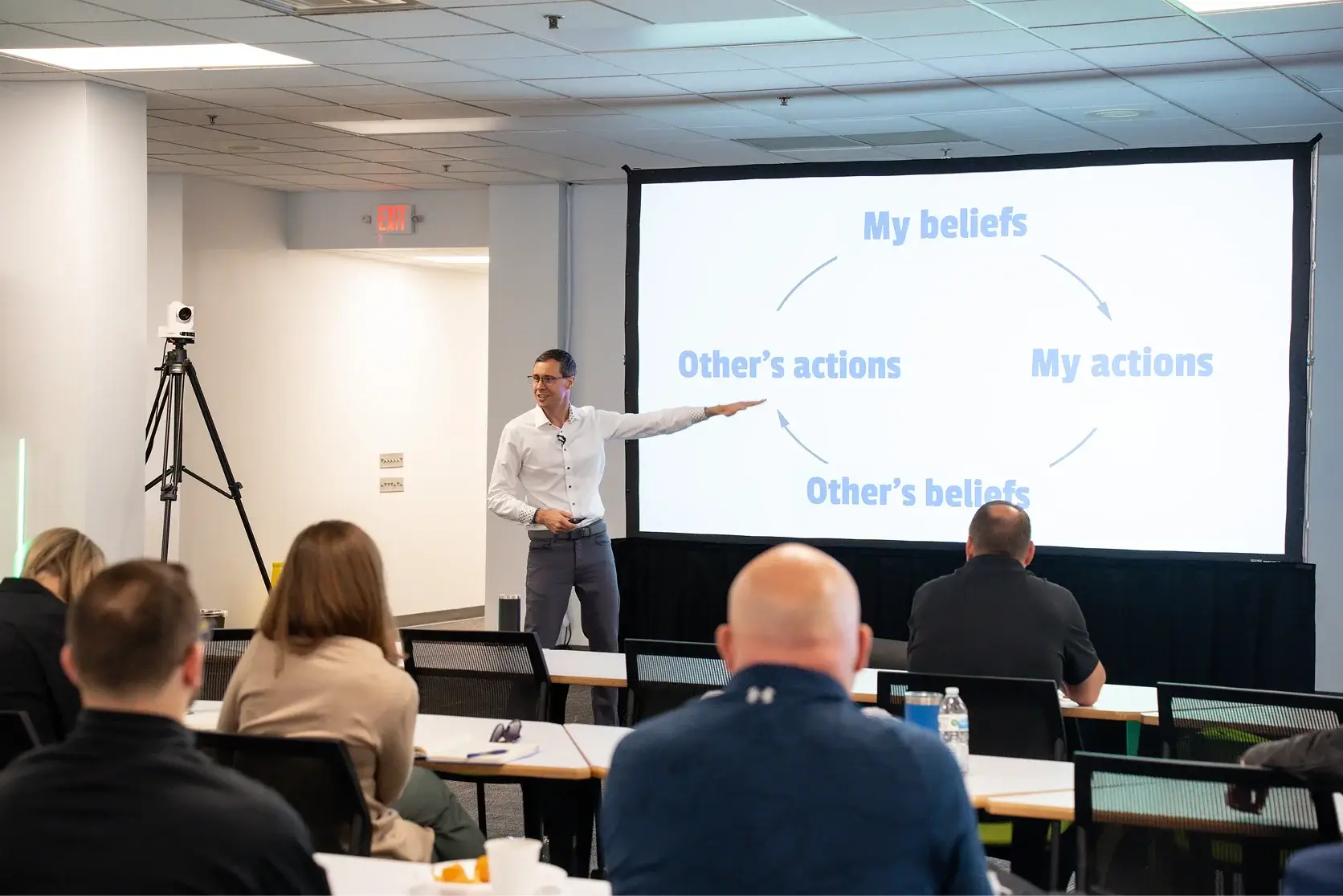 Joshua Berry presenting a framework slide to a workshop audience