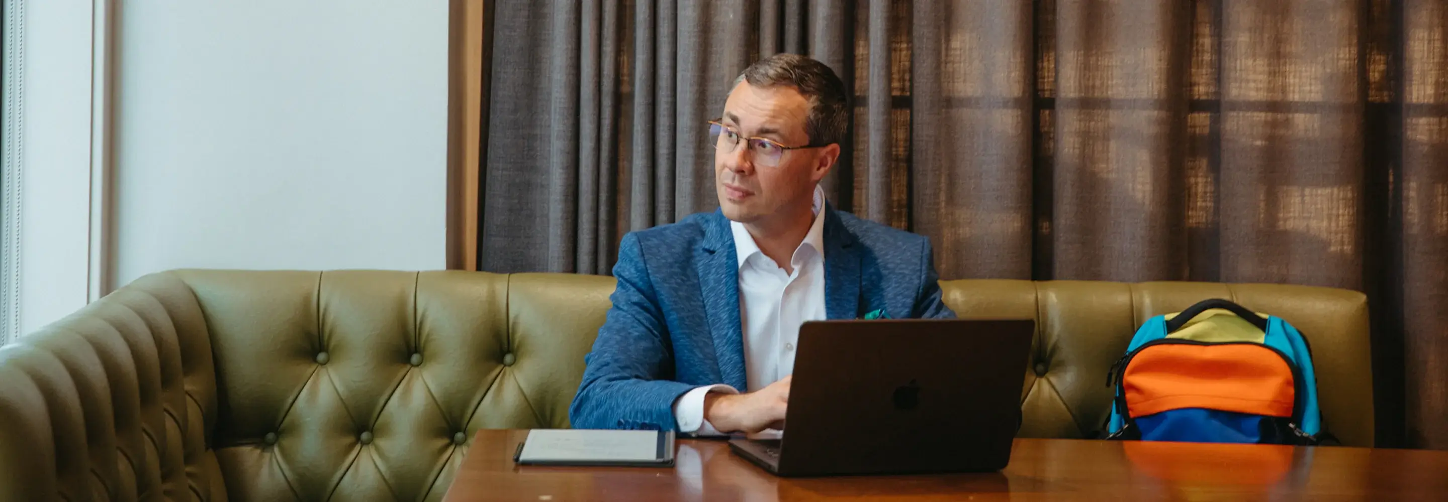 Joshua Berry working on a laptop at a table